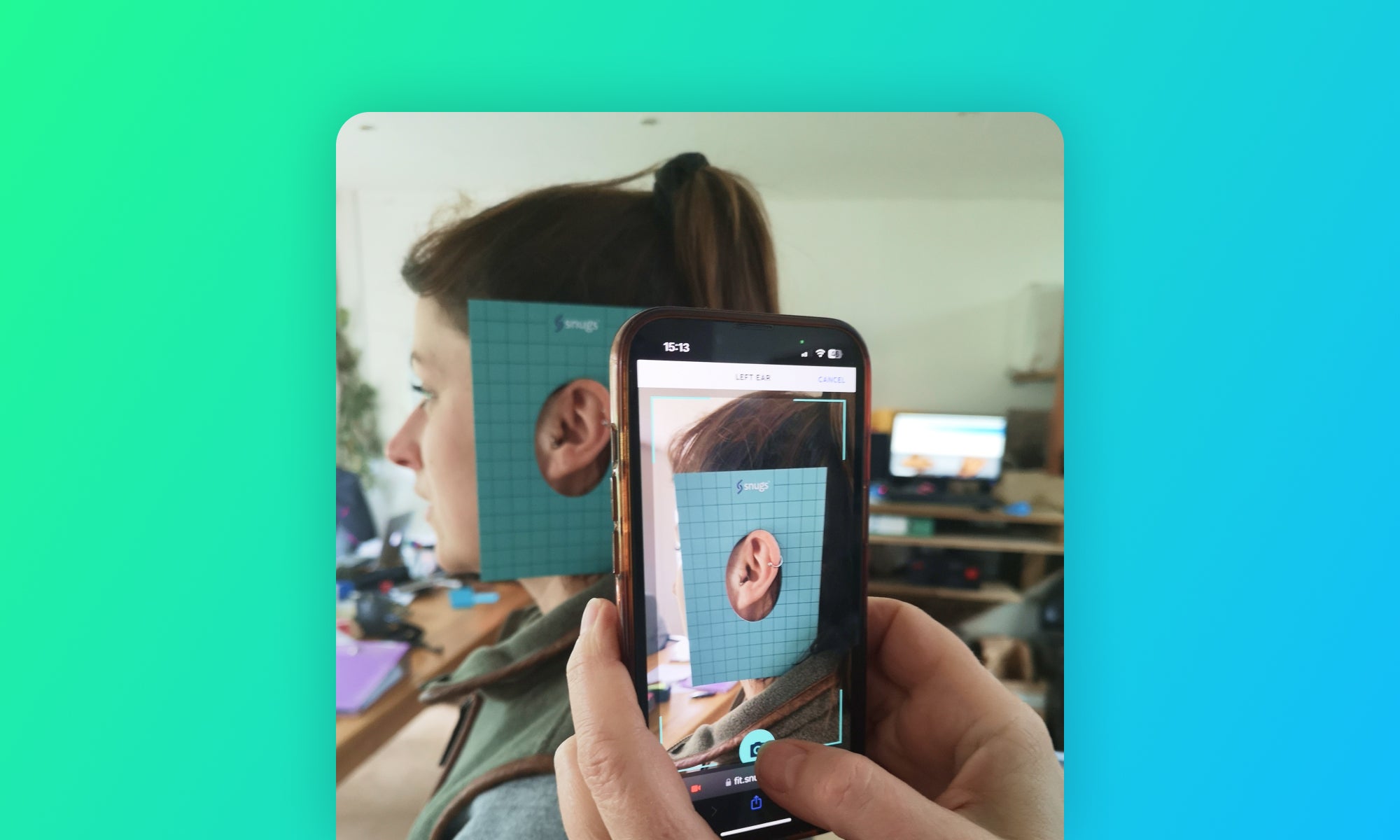 Person using Snugs fitting app to take pictures of person wearing fitting card over ear