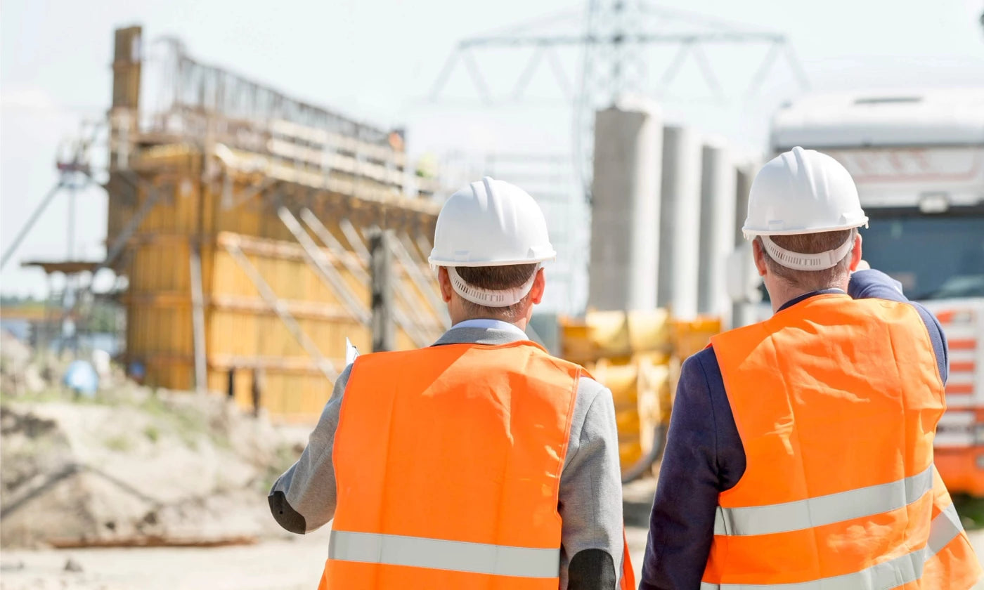 two construction engineerings wearing hearing protection